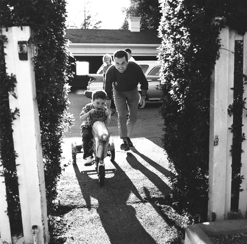 Jackie Cooper playing with his son Russell at their home in Brentwood, CA