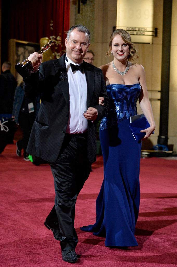 Neil Corbould, winner of Best Achievement in Visual Effects and Maria Pudlowska leave the Oscars at Hollywood & Highland Center on March 2, 2014 in Hollywood, California.