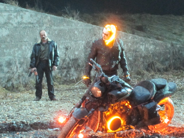 Still from 'Ghost Rider' Nick Cage getting hot under the collar! very cool bike though.