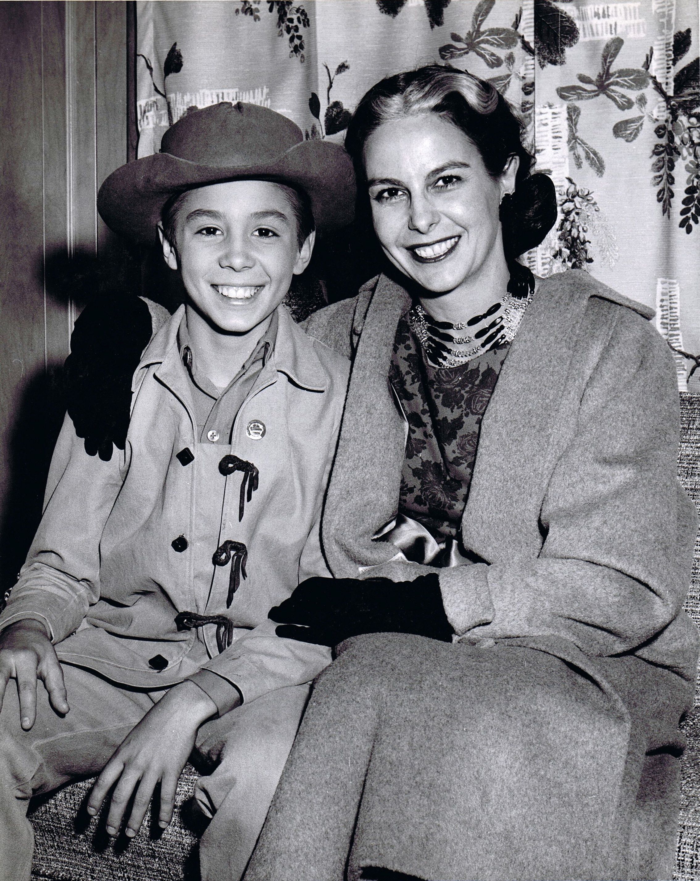 Betty Crawford with her son, Johnny, while he was appearing with Chuck Connors at the Annual Ak-Sar-Ben Rodeo in Omaha, Nebraska (1959).