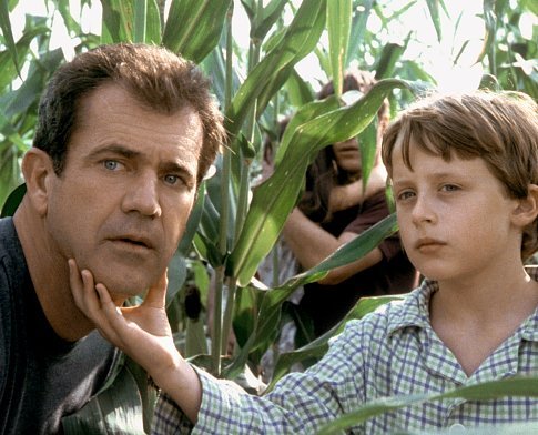 Morgan Hess (Rory Culkin, right) shows his father, Graham (Mel Gibson, left) what's going on.
