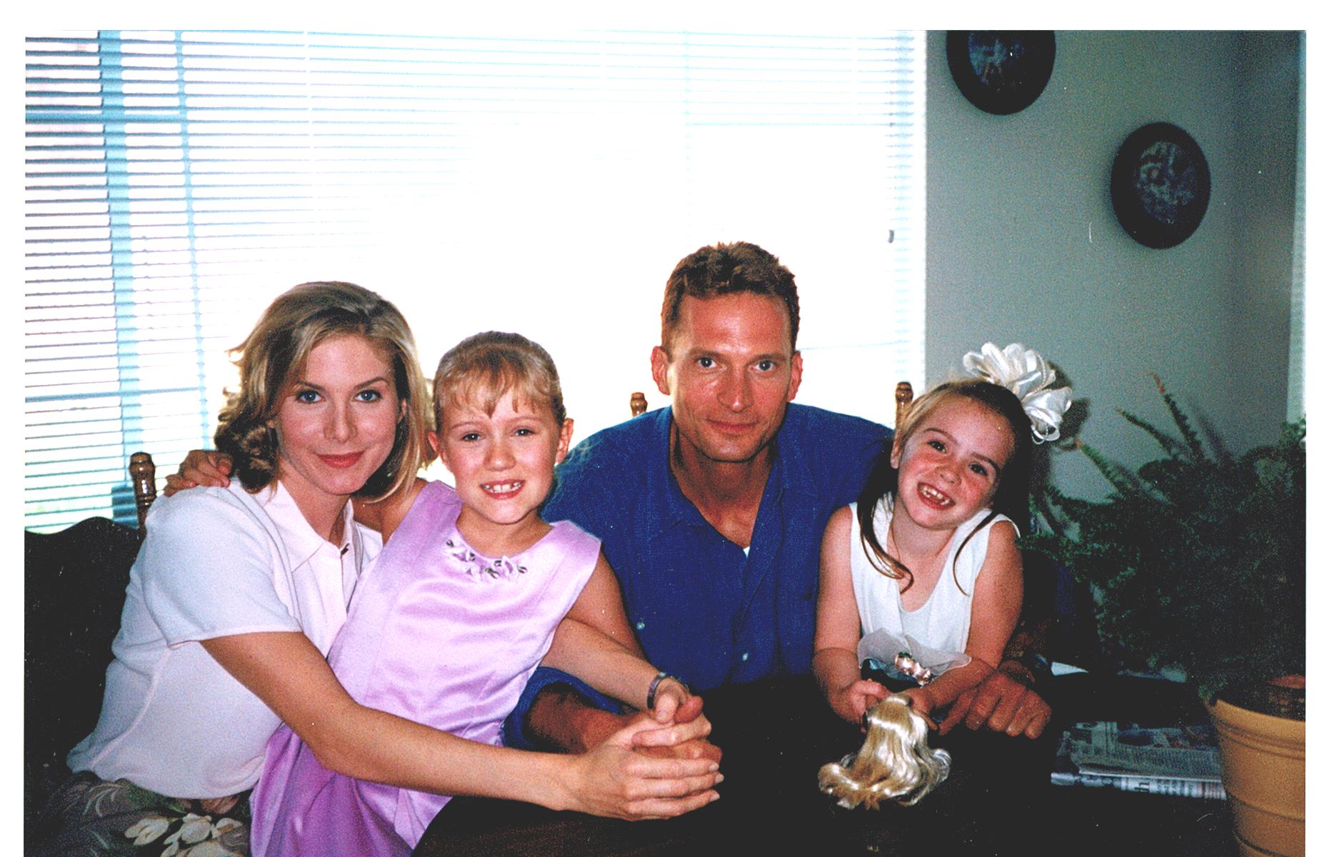On the set of JAG: The Court-Martial of Sandra Gilbert (1997 TV episode): Elizabeth Mitchell, Aria Noelle Curzon, Rex Smith, and Camryn Grimes