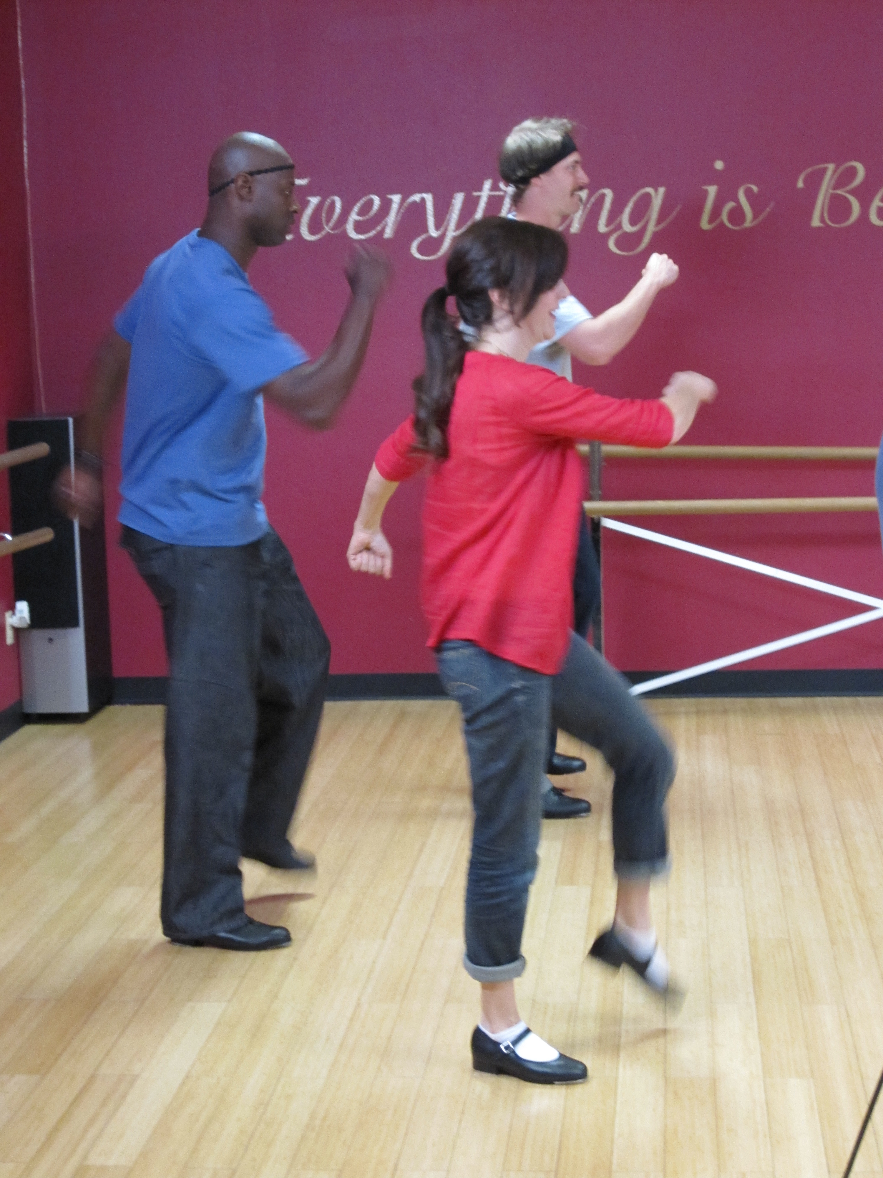 Nadia Dajani tap dancing with baseball players LaTroy Hawkins and John Axford.