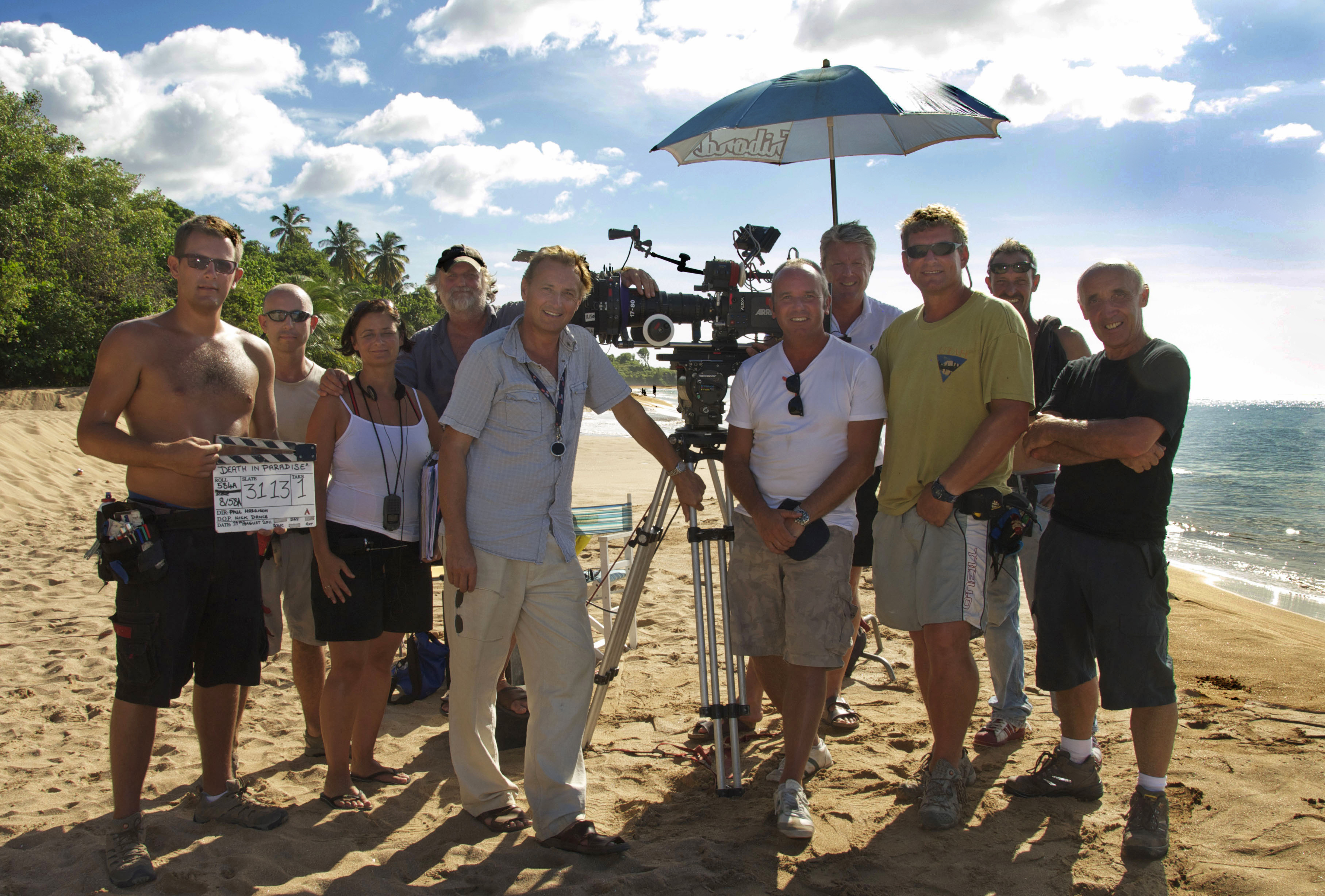 Nick (centre left) with crew shooting Death In Paradise in Guadeloupe
