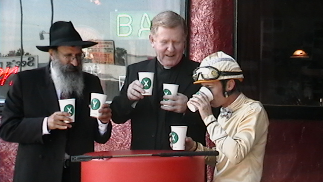 The Priest doing STARBUCKS holy water with his buddies.