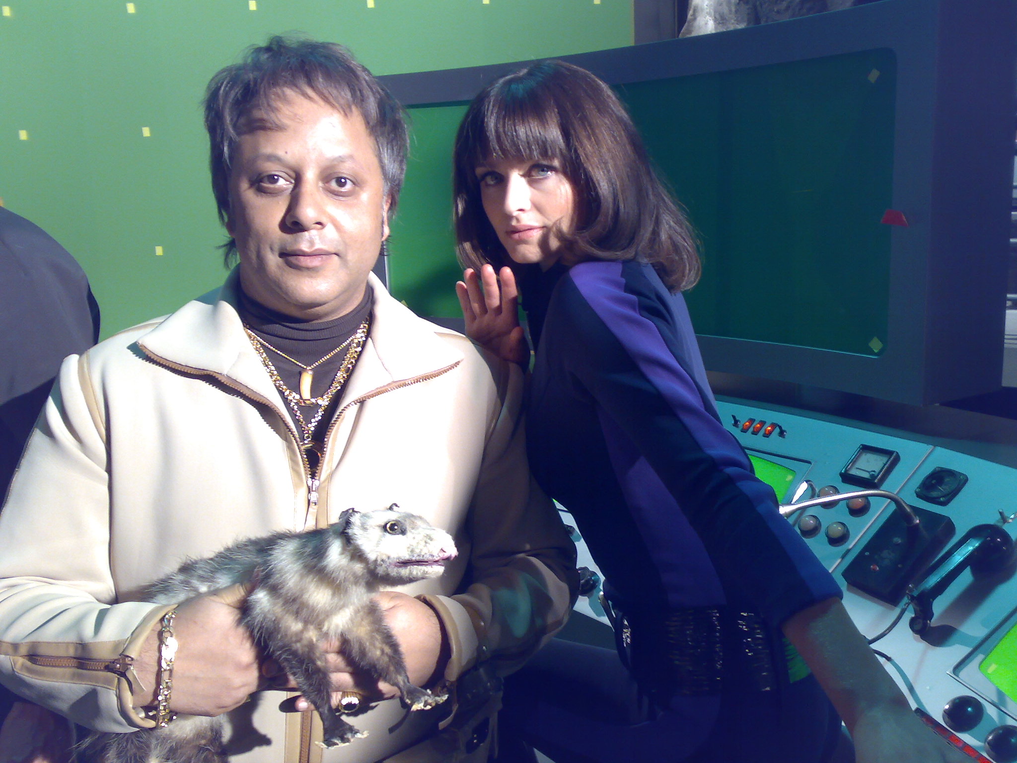 Kammy Darweish as Mega Villain on the set of Capital One's 'Mega Villain' TV Commercial (with Jess Murphy and 'Reggie the Possum')