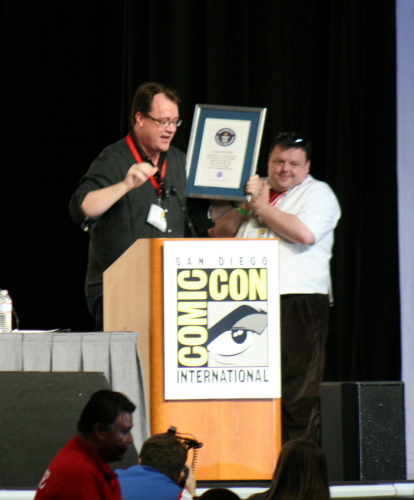 Producer Russell T. Davies accepts an award from Guinness World Records representative Craig Glenday for the most successful Sci-Fi TV series ever.