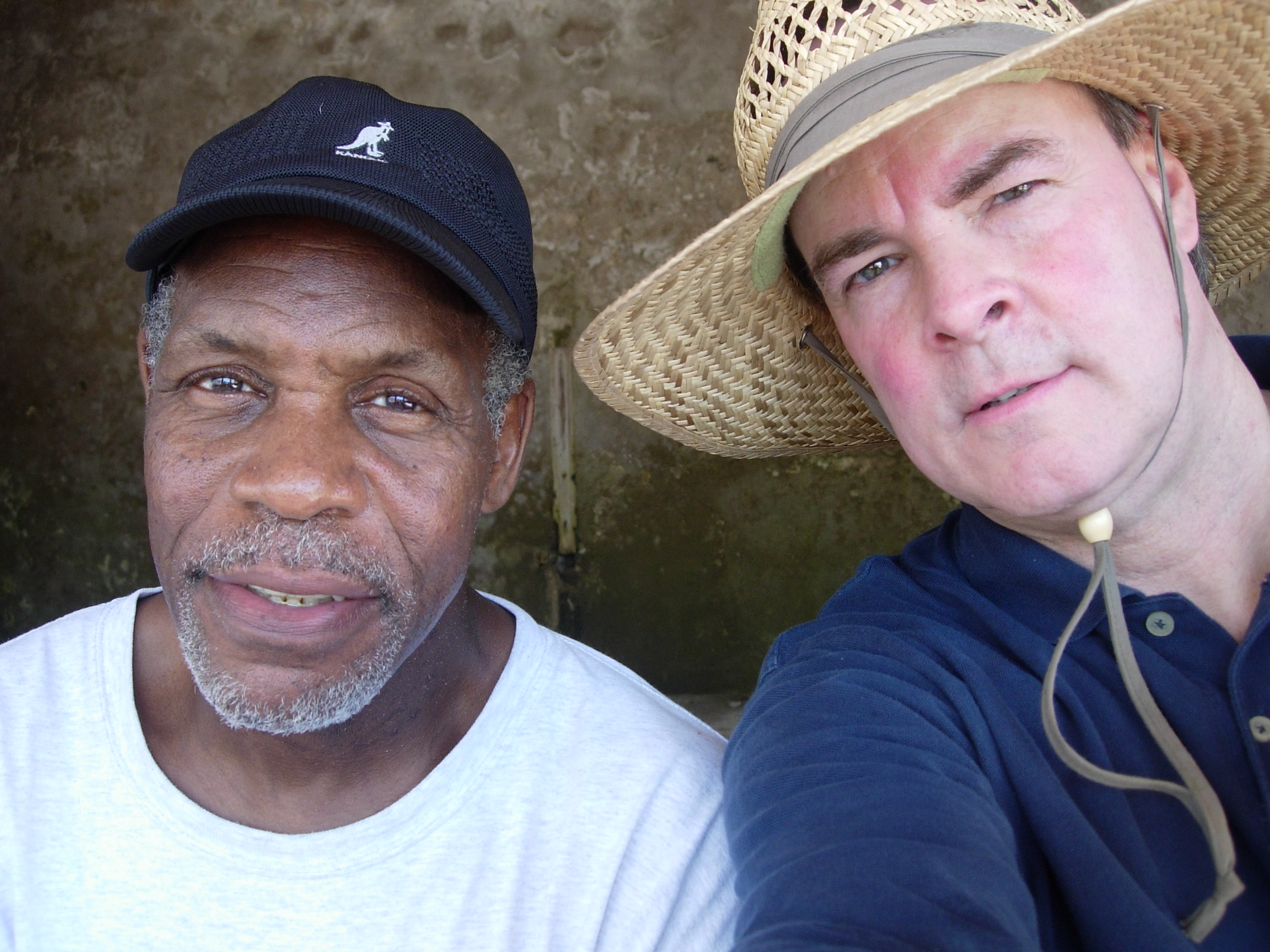 John F. Davis with Danny Glover on Isla de Mozambique while scouting 