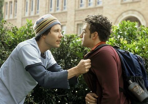 Adam (Michael Rosenbaum, left) tries to reason with his fraternity 