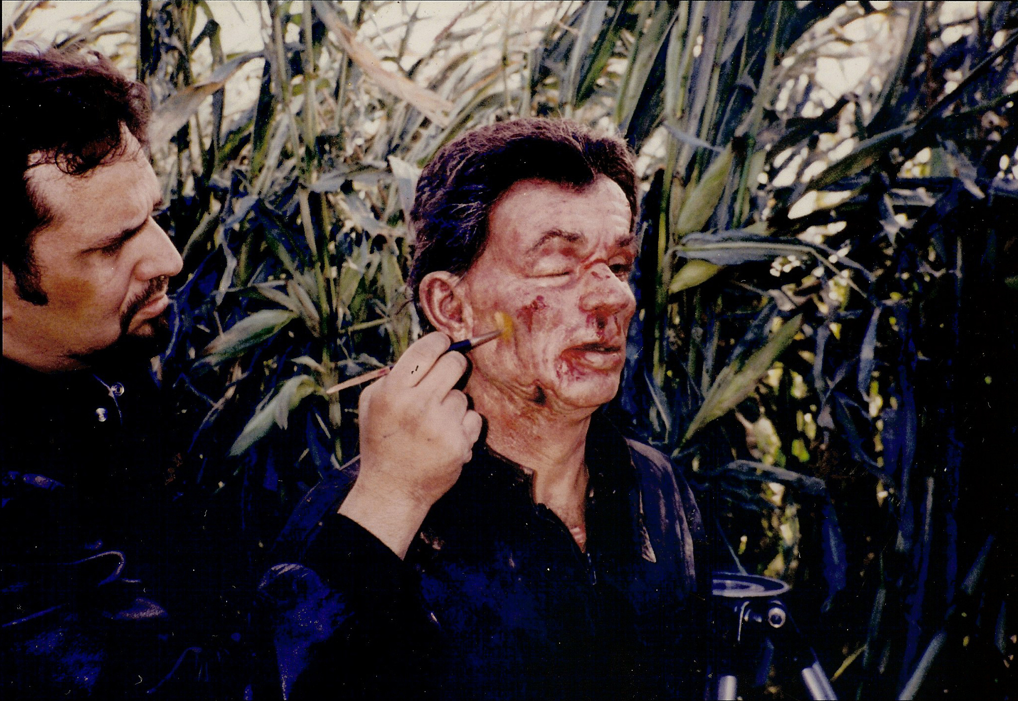 Ken Diaz applies final color adjustments to the Bat Beating prosthetic makeup on Phillip Suriano as Dominick Santoro, on the set of 