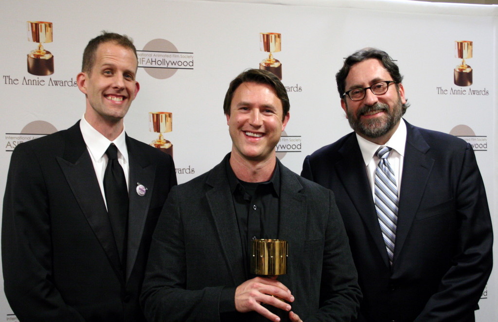 TV production design winner Andy Harkness between presenters Pete Docter and Bob Peterson