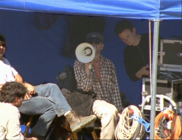 Janusz Kaminski (left rear) Steven Spielberg (middle) and Noel Donnellon (right) on set 'Saving Private Ryan' 1997. Frame grab from Into the Breach: 'Saving Private Ryan' (1998)