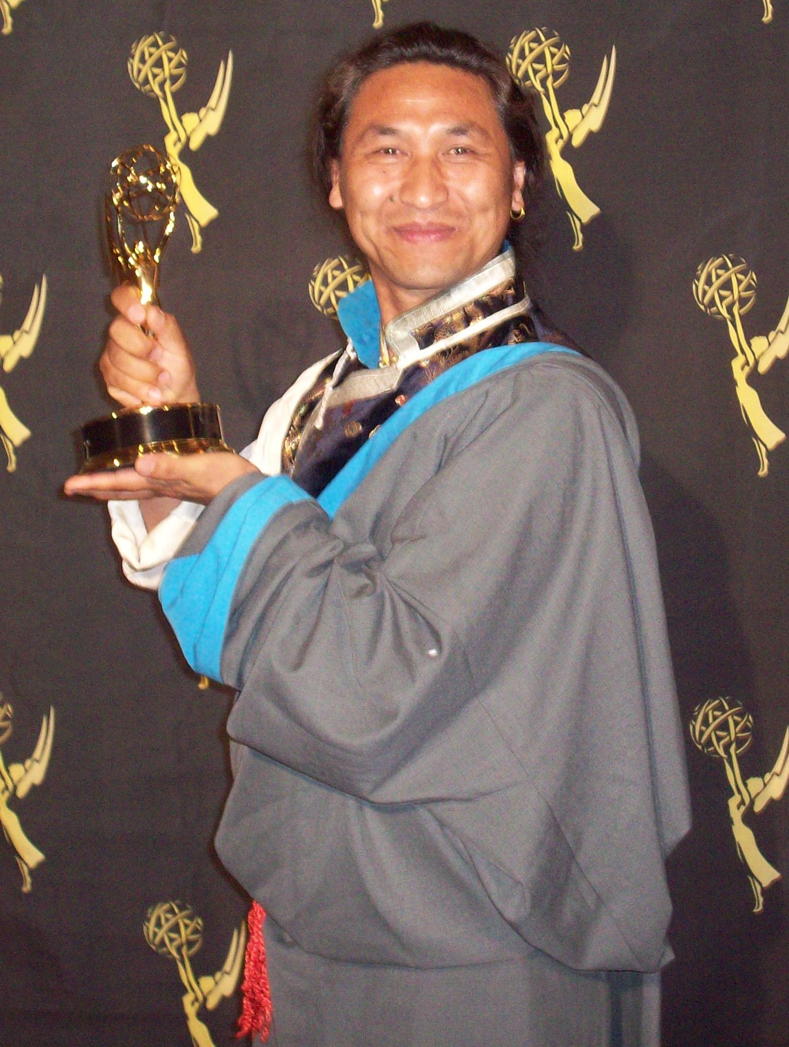 Tsering Dorjee bawa hold a Emmy Award.
