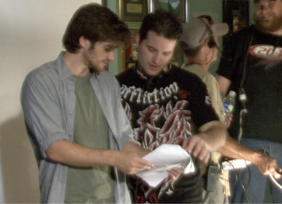 Jeffrey Adler and Danny Draven discussing a scene on the set of REEL EVIL.