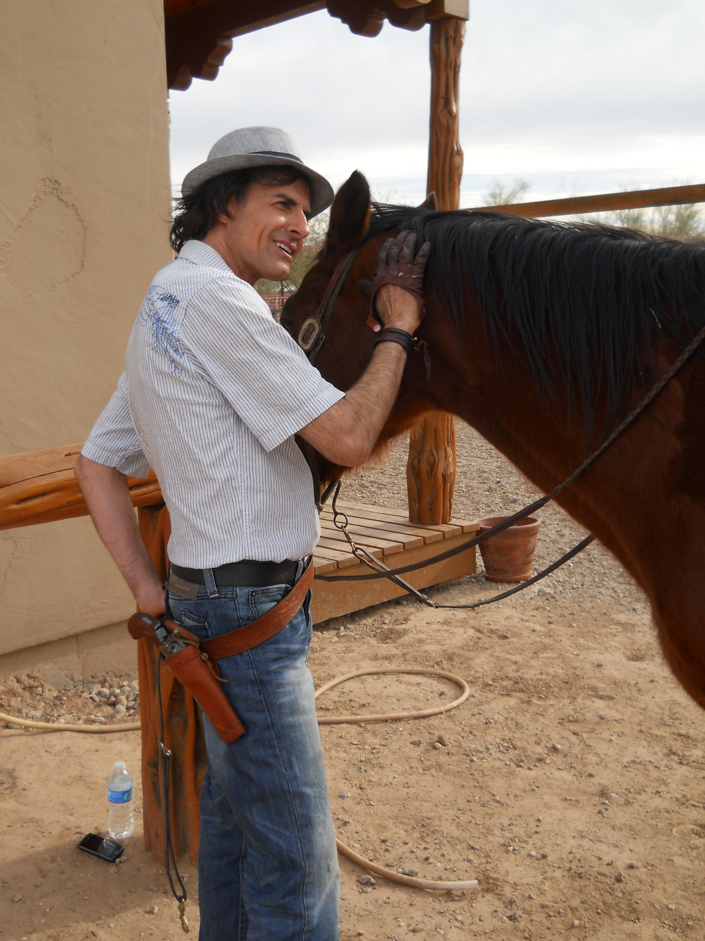Actor writer director Philippe Durand with horse training for a western