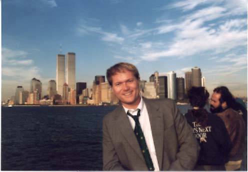 Jim Dykes on New York harbor with World Trade Center in distance.