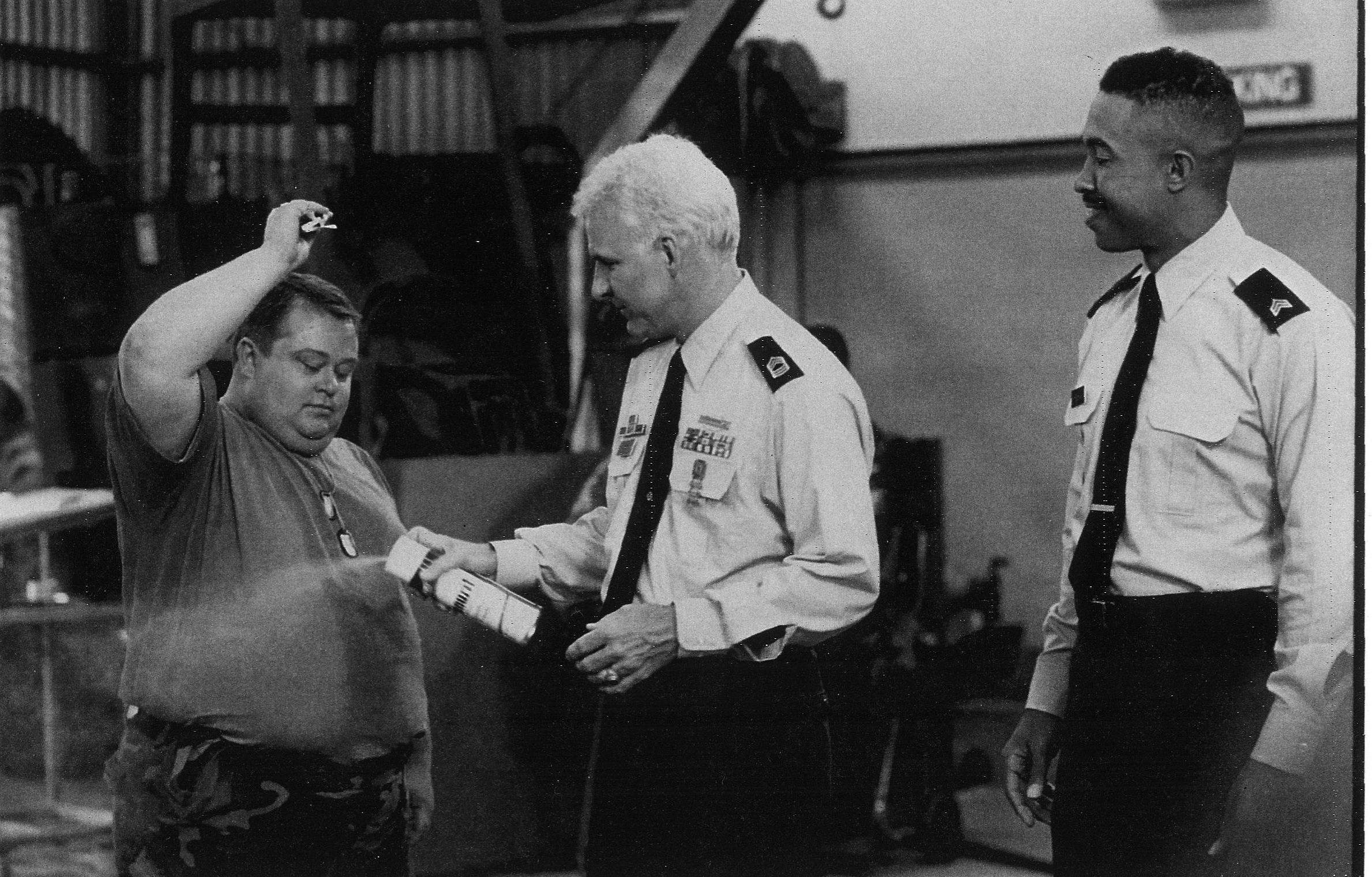 Eric Edwards as Pvt. Doberman, Steve Martin as Sgt. Bilko, and John Marshal Jones