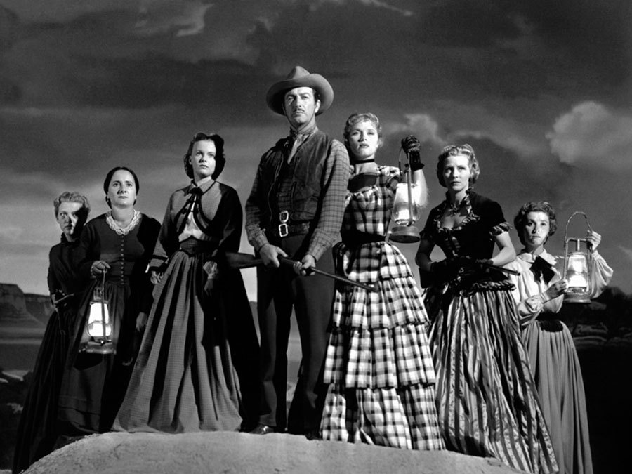 Still of Robert Taylor, Julie Bishop, Denise Darcel, Beverly Dennis, Hope Emerson, Marilyn Erskine and Lenore Lonergan in Westward the Women (1951)