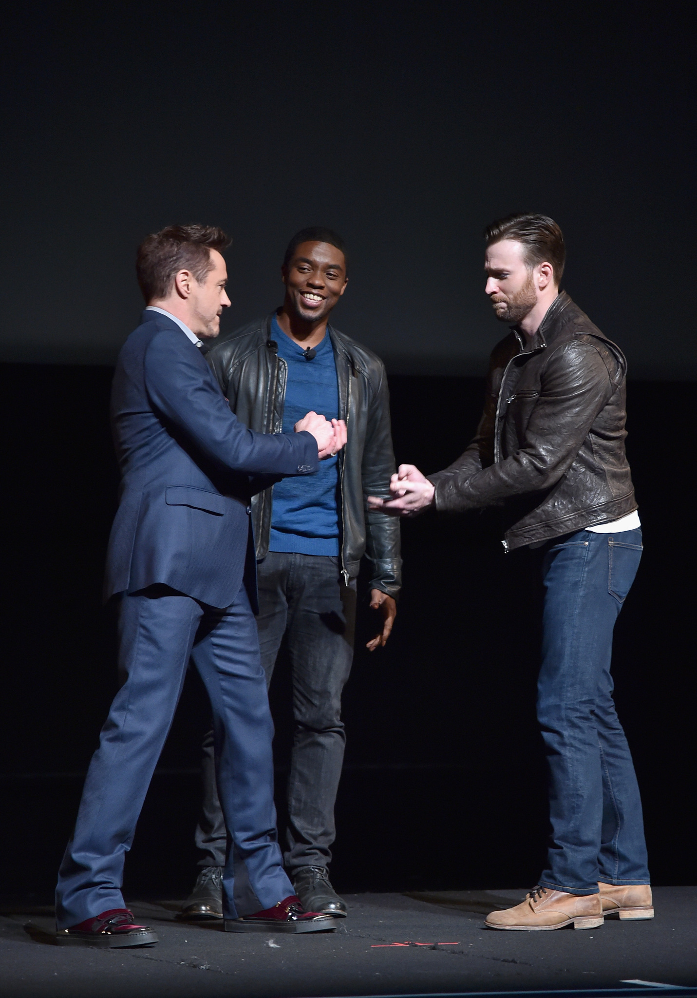 Robert Downey Jr., Chris Evans and Chadwick Boseman at event of Black Panther (2018)