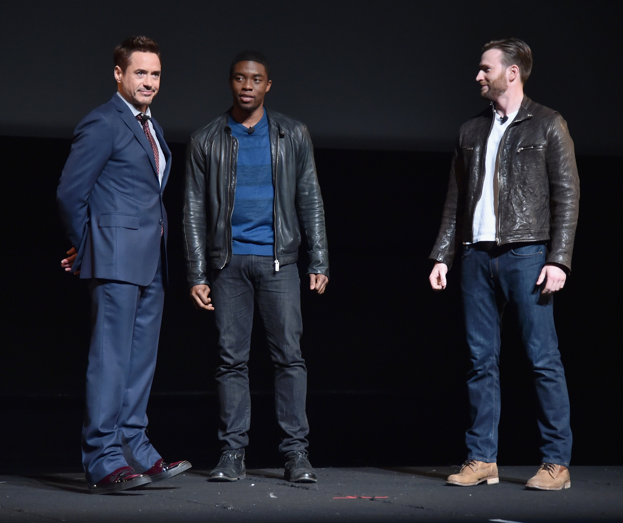 Robert Downey Jr., Chris Evans and Chadwick Boseman at event of Black Panther (2018)