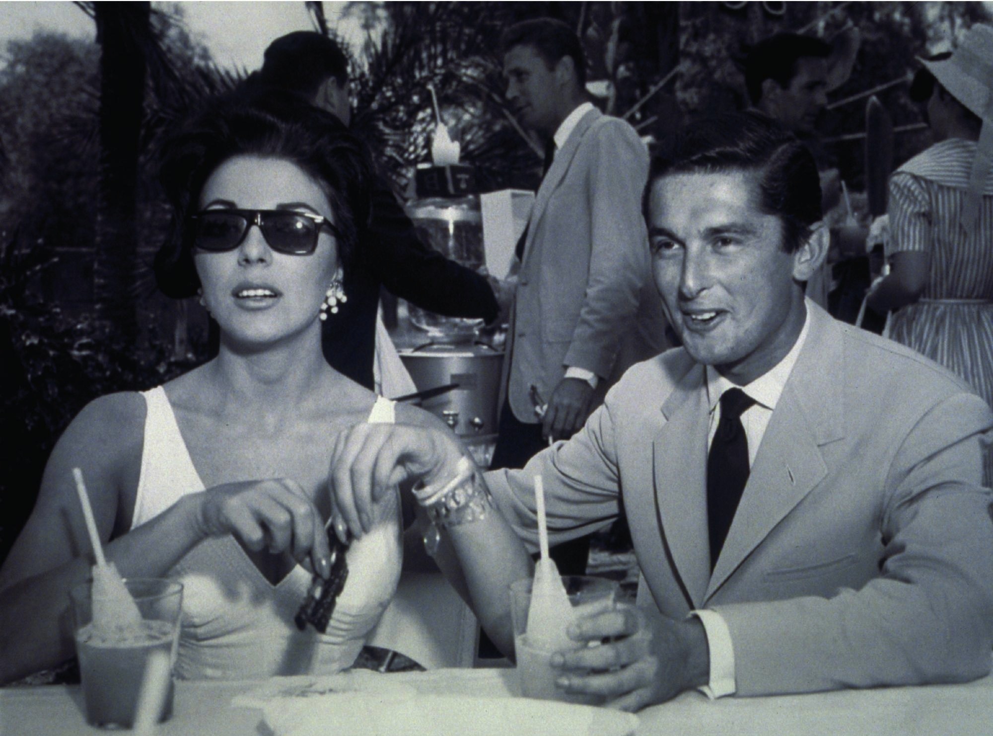 Still of Joan Collins and Robert Evans in The Kid Stays in the Picture (2002)