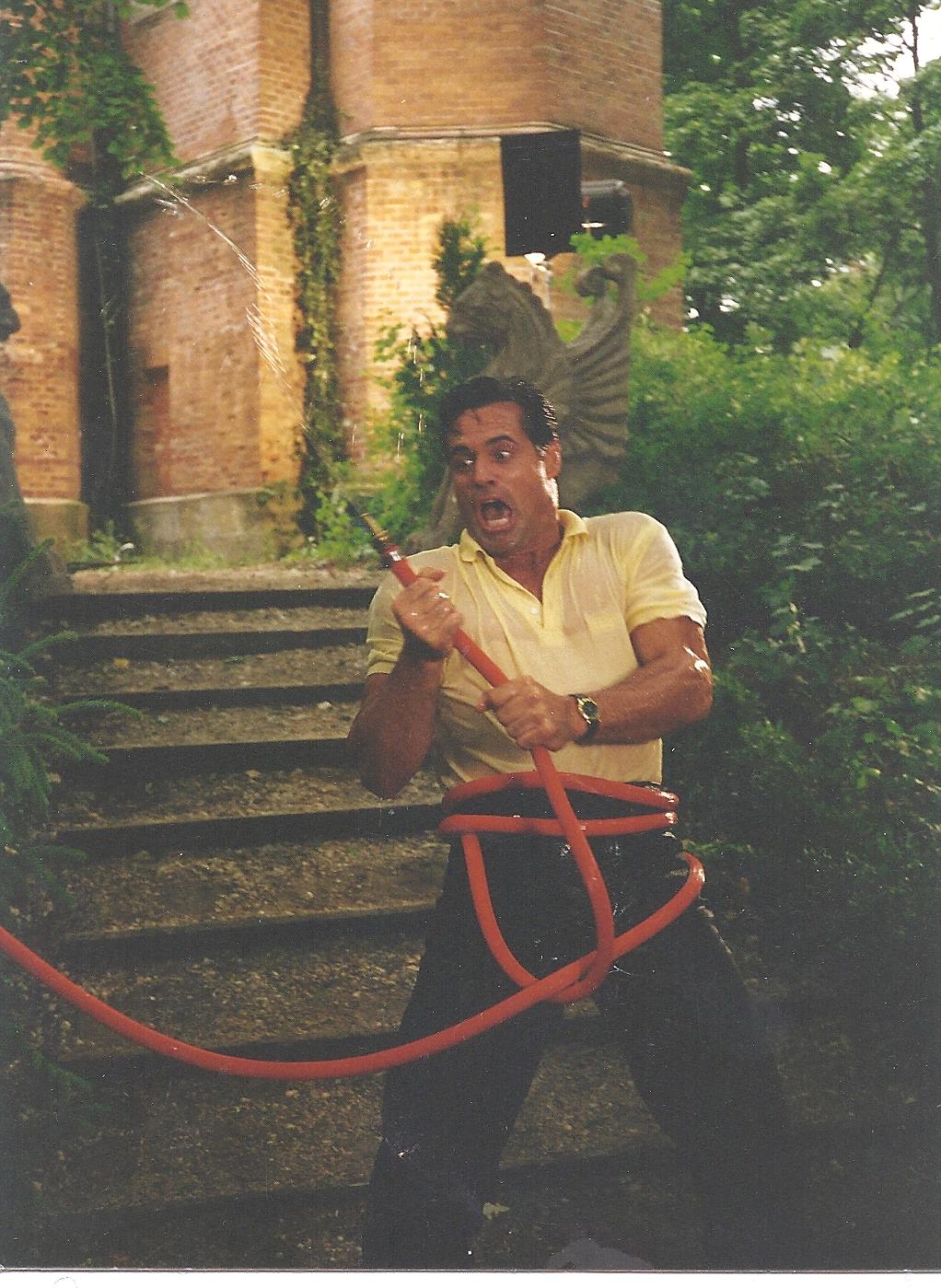 In Transylvania Romania, actor Jim Fitzpatrick (Starring as Tony) wrestles with a possessed-hose, in the children's film, 