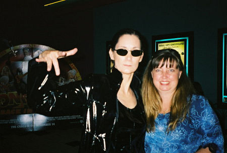 Deborah Smith Ford, as MATRIX'S Trinity lookalike, posing with a fan, Lisa Wild, at the 