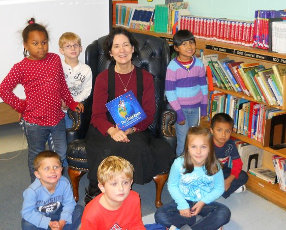2012 promotional school and book tour photo of Ford with school children in Alabama.