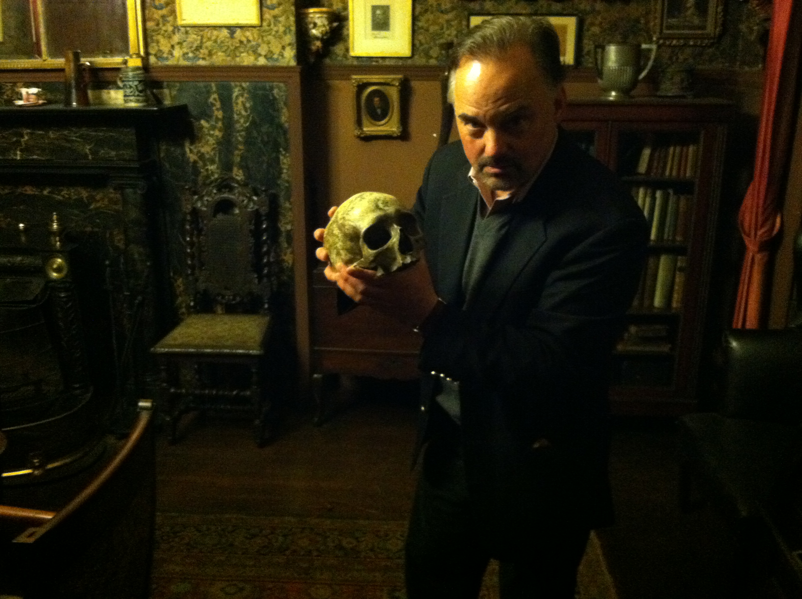 The Edwin Booth Room at The Players in NYC holding the skull that Booth used in Hamlet.
