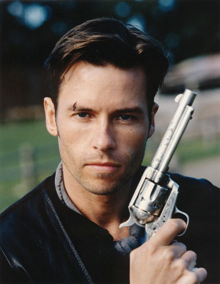 Guy Pearce with the engraved Colt 1873 Revolver used in Snowy River: The McGregor Saga, this revolver is one of a pair of engraved 1873 Colts that were used on the set.