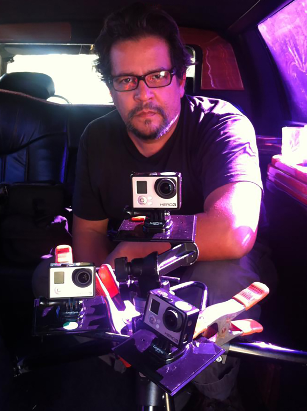 Photographer Eddie Garcia with a few GoPro cameras.