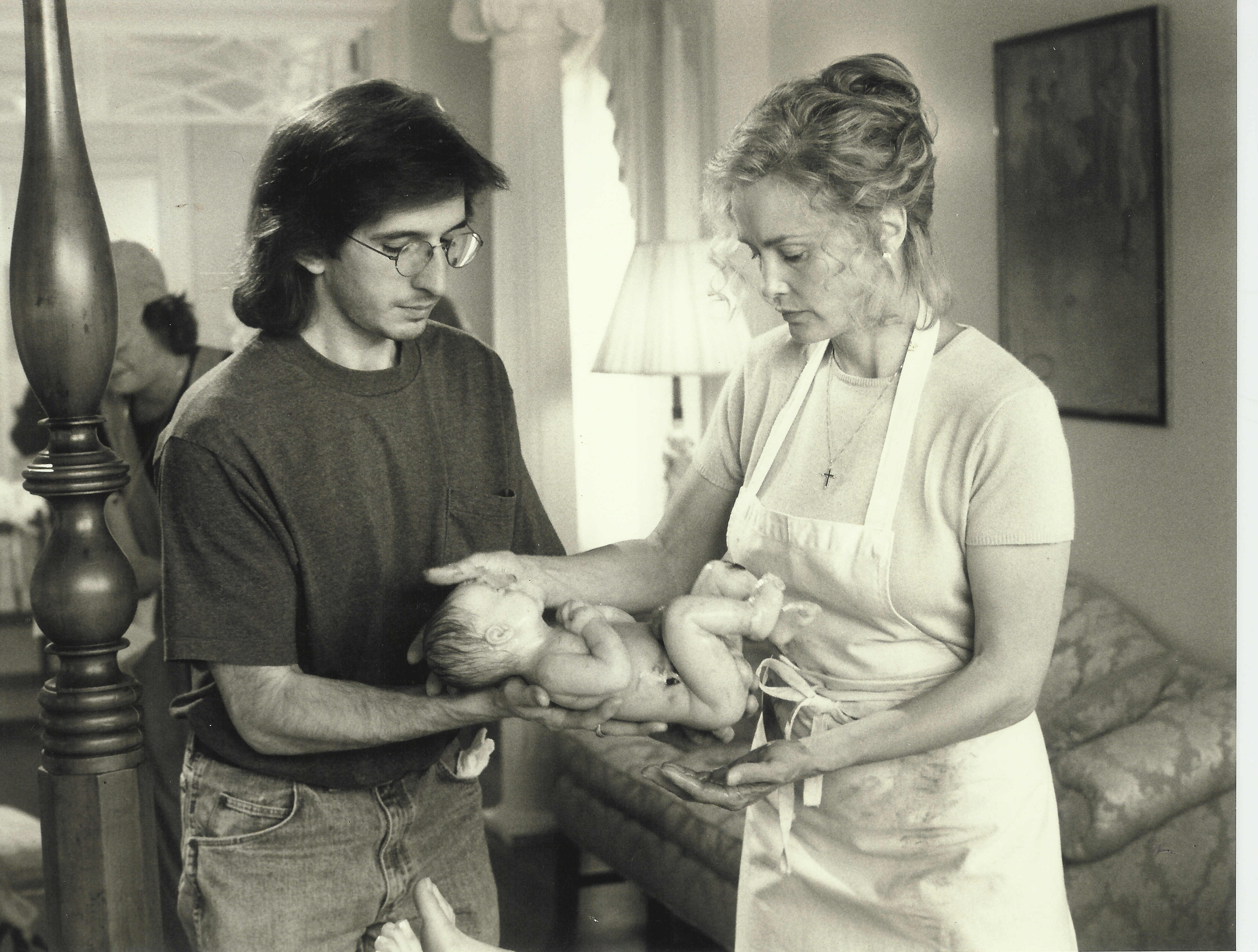 Makeup effects artist Tony Gardner sets up a shot with Alterian's animatronic baby on set with actress Jessica Lange.