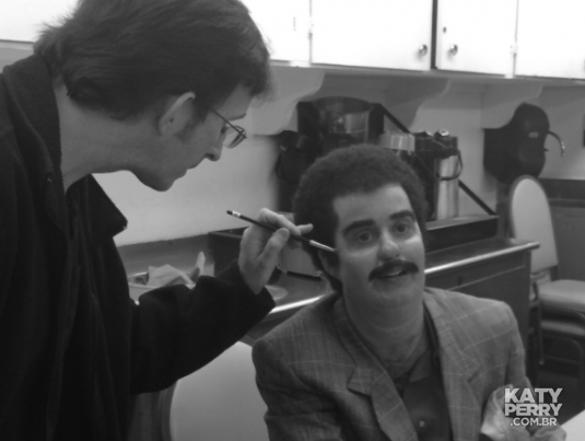 Makeup Effects Designer Tony Gardner touches up Katy Perry wearing one of the prosthetic makeup effects characters his team created for Perry's 