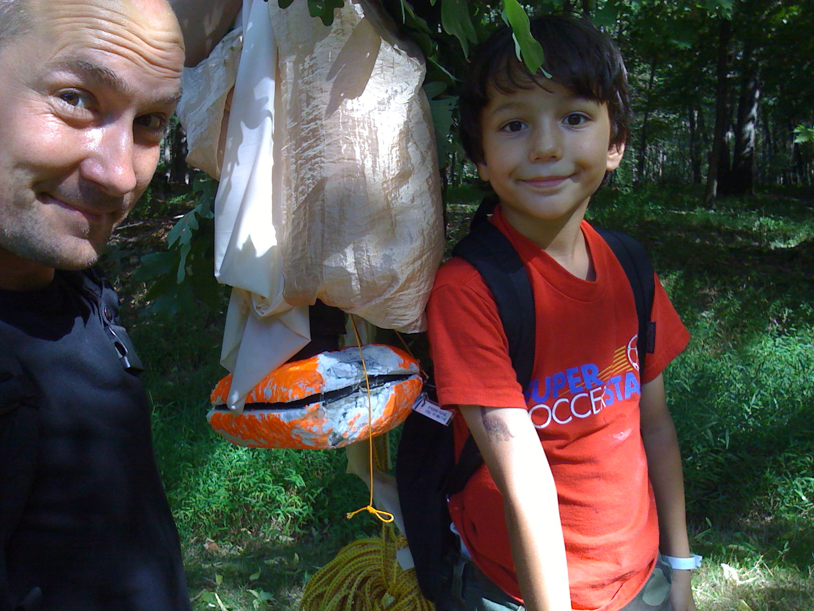 Luke Geissbühler and Max Geissbühler retrieving their homemade spacecraft in the short film Space Balloon.