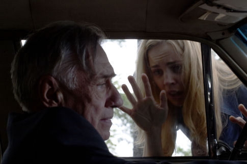 Kathy (MELISSA GEORGE) tries to get Father McNamara's (PHILIP BAKER HALL) help in THE AMITYVILLE HORROR.