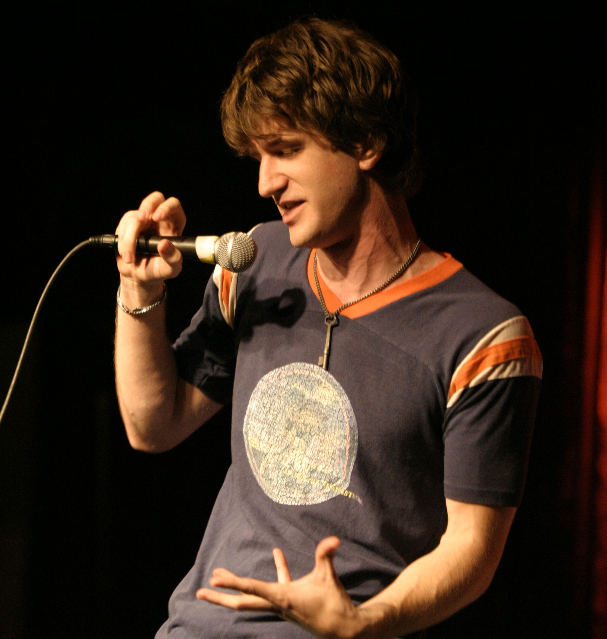 Brett Gilbert performing stand-up.