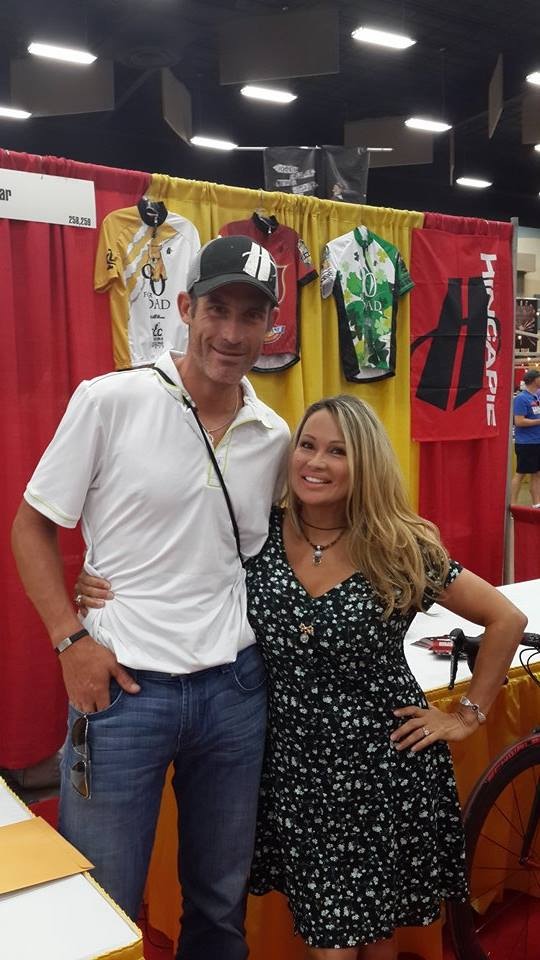 Tour de Force life strategist Lisa Christiansen and Tour de France cycling legend George Hincapie make an appearance at the 2014 HHH100 expo before riding the 100 mile endurance ride in triple digits through hells gate.