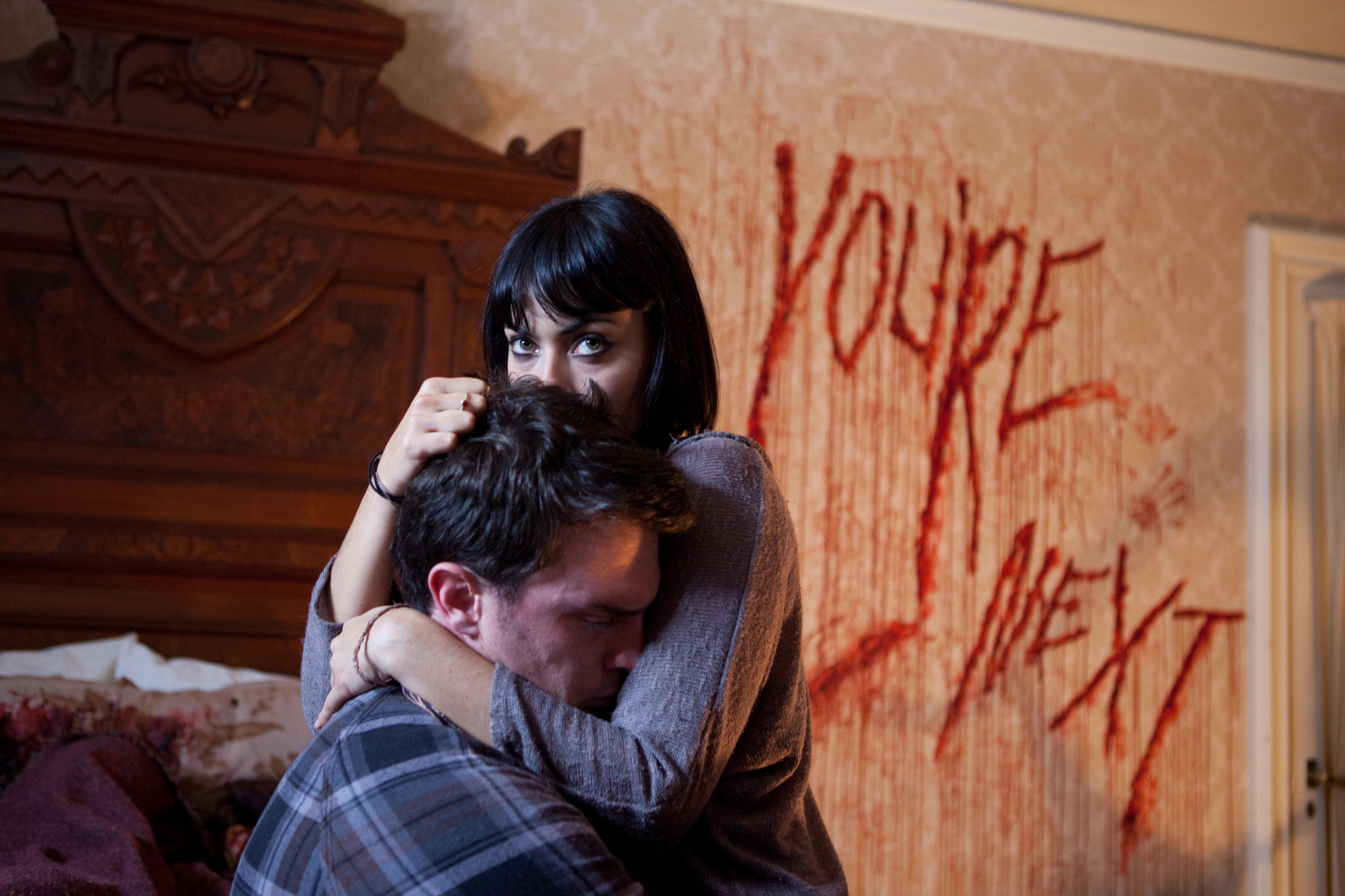 Still of Wendy Glenn and Nicholas Tucci in You're Next (2011)