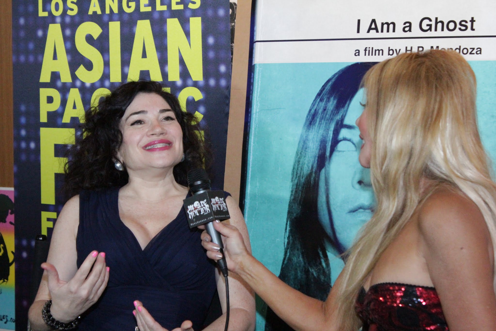 (L to R) Actress Karen-Eileen Gordon being interviewed by Dawna Lee Heising for MoreHorror.com and Eye On Entertainment, at the Los Angeles Asian Pacific Film Festival (Directors Guild of America)