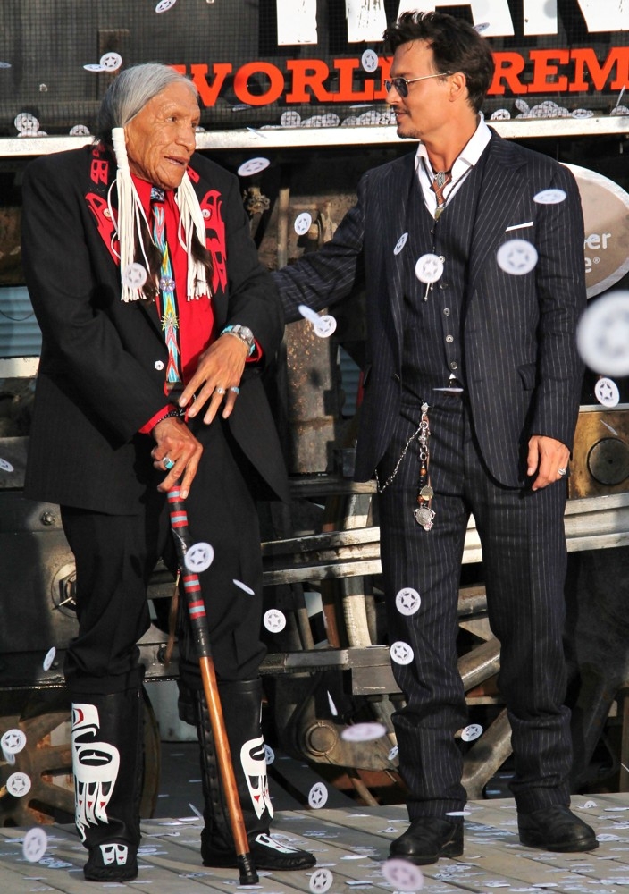 Saginaw Grant and Johnny Depp celebrate at the Lone Ranger movie premiere. July 2013