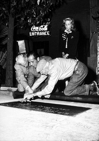 Humphrey Bogart, Lauren Bacall, and Sid Grauman, circa 1946.