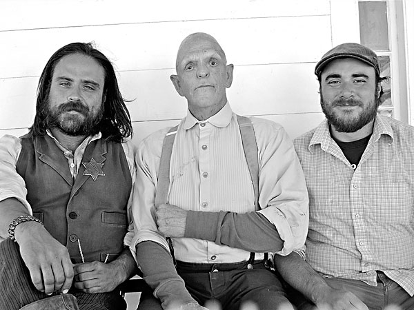 L-R: Co-director Justin Meeks, veteran character actor Michael Berryman (One Flew Over the Cuckoo's Nest, Weird Science, The Hills Have Eyes), and co-director Duane Graves on set of the dark western RED ON YELLA, KILL A FELLA, December, 2012