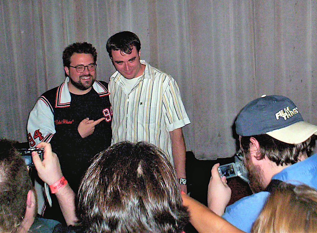 Duane Graves (Up Syndrome) accepts the grand jury prize from Kevin Smith (Clerks, Chasing Amy) at the 2006 Movies Askew Awards in Los Angeles, California.