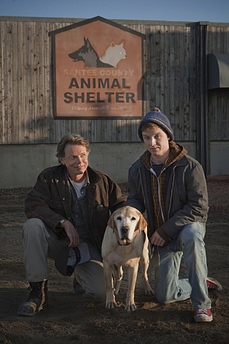 Still of Noel Fisher and Bruce Greenwood in A Dog Named Christmas (2009)