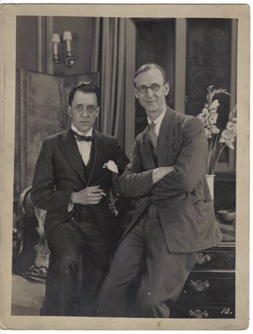 Edwin Greenwood, standing on the right, wearing glasses, with unknown man.