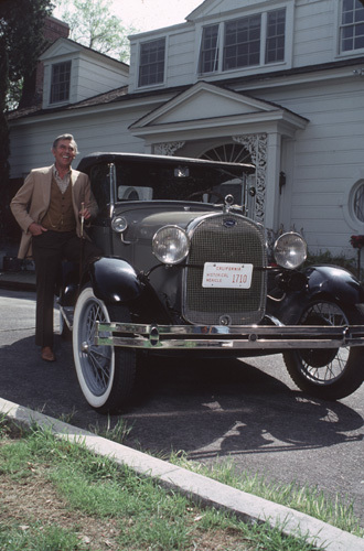 Andy Griffith and his 1938 Ford Phaeton at his Toluca Lake Home in CA. 1979