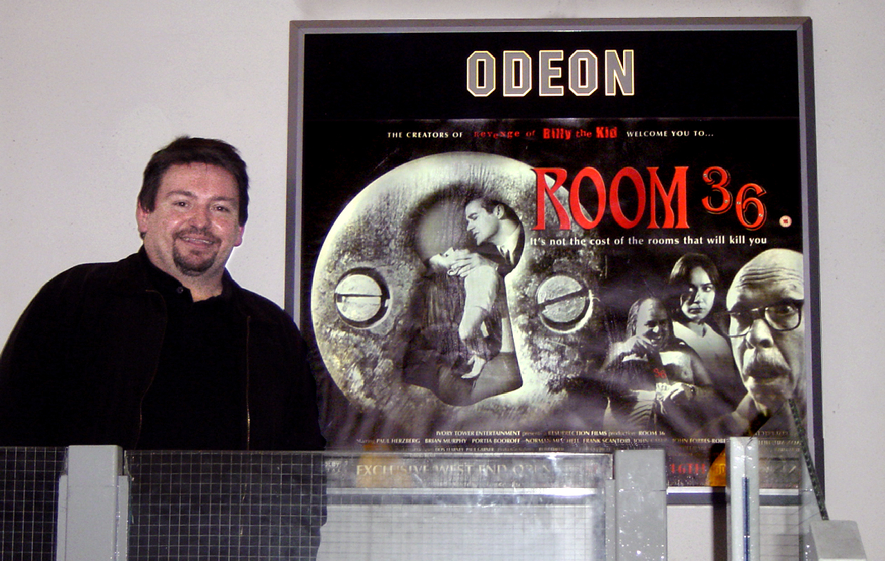 Jim alongside the Room 36 poster inside the Odeon Panton Street off London's Leicester Square where it ran for two weeks.