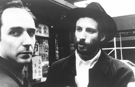 Renegade mathematician Max Cohen (Sean Gullette, left) and the leader of the Kabbalah sect, Lenny Meyer (Ben Shenkman) have a chance encounter on a Chinatown street corner.