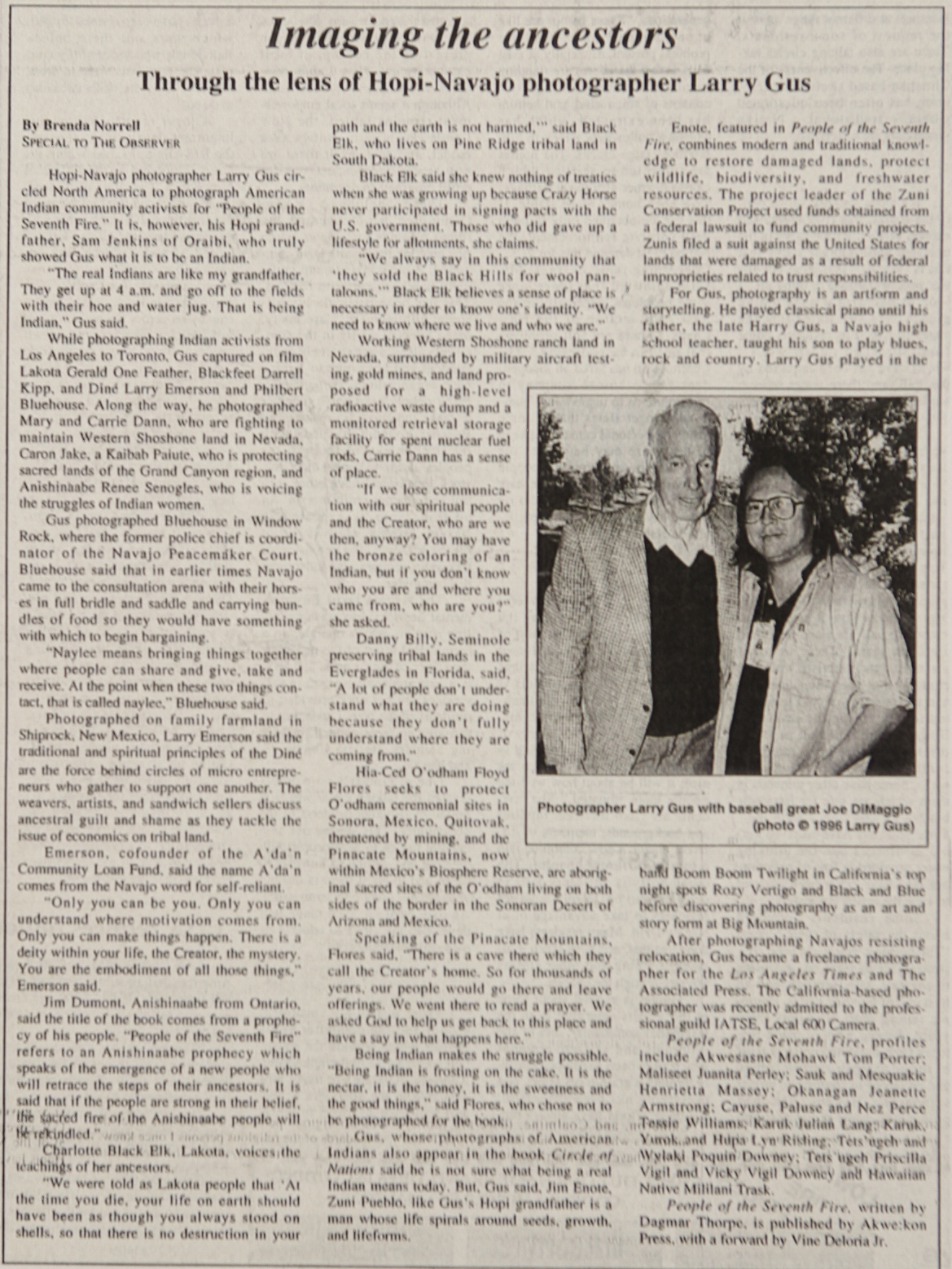 Article about Photographer Larry Gus with photograph of the photographer next to baseball great Joe DiMaggio.