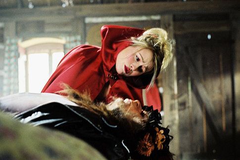 Mitsou Gelinas as Little Red Riding Hood and Marc Labrèche as The Big Bad Wolf in the Denise Filiatrault film ALICE'S ODYSSEY